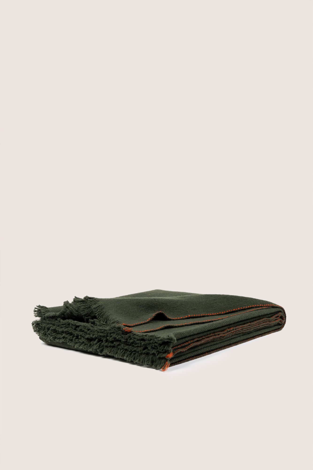 OAK local merino wool throw in green tone with orange edge